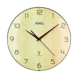 A round, wall-mounted radio-controlled clock with a light-colored wooden frame and a simple, minimalist design. The clock face features large, easy-to-read numbers and hands.