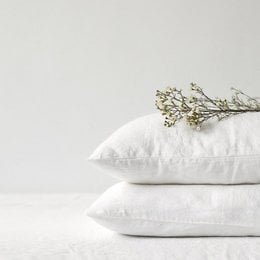 White linen pillowcase, available in various sizes for standard, northern Europe, euro sham, EU IKEA, DE King, EU Standard, Southern Europe, DE Small, UK King, Scandinavian, and EU King beds. Made of soft, breathable linen material.