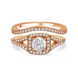 The Silver Majestic Ring is a rose gold engagement ring featuring a round diamond center stone surrounded by a halo of smaller diamonds. The ring is available in multiple sizes to fit a range of finger sizes.