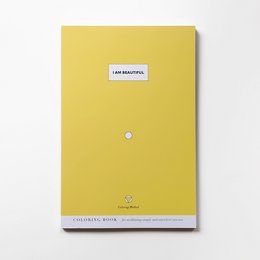 A yellow hardcover book titled "I Am Beautiful" with a simple design and minimal text on the cover.