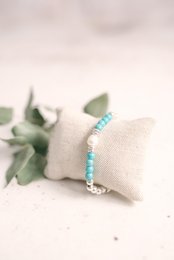 Turquoise beaded bracelet with a delicate, minimalist design. Suitable for casual or formal wear.