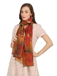  Fine wool stole with digital print in vibrant red and orange tones, ethically sourced and sustainably produced.