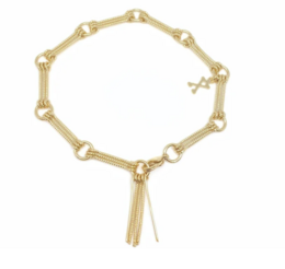 Gold-toned charm bracelet with dangling tassels and green beads. Stylish accessory for holiday or casual wear.