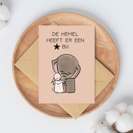 A condolence card with a comforting illustration of a person embracing a smaller figure, with the text "Heaven has gained a star" in Dutch.