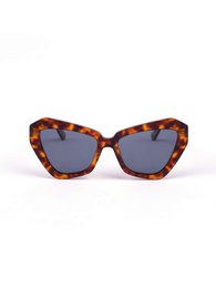 Tortoiseshell cat-eye sunglasses with dark lenses.