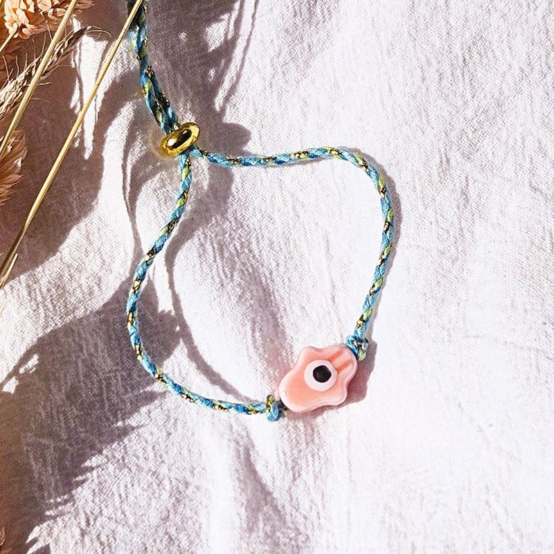 Bracciale Hamsa intrecciato a mano rosa