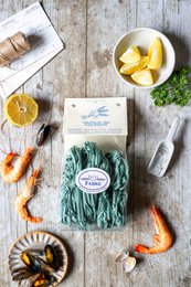 Green spirulina algae tagliatelle pasta nests, organic whole wheat, natural ingredient, Italian style.