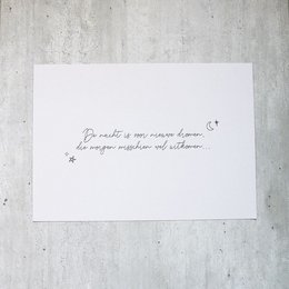 A4 poster with the text "The night is for dreams" written in cursive script. The poster has a minimalist, artistic design.