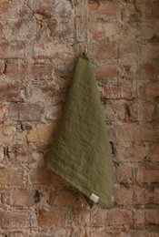 Olive green linen kitchen towel with a soft, textured appearance and natural fibers that are durable and absorbent, suitable for everyday kitchen use.