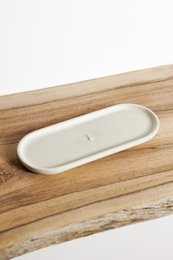 Rectangular decorative tray made of limestone, featuring a neutral color palette and simple, minimalist design.