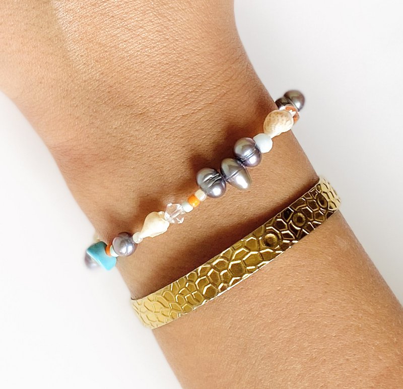 Armbånd med orange ferskvandsperler