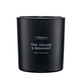 A round, tall black candle with the scent of pink orange and bergamot.