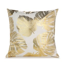 Decorative throw pillow with large tropical leaves in shades of yellow and brown.