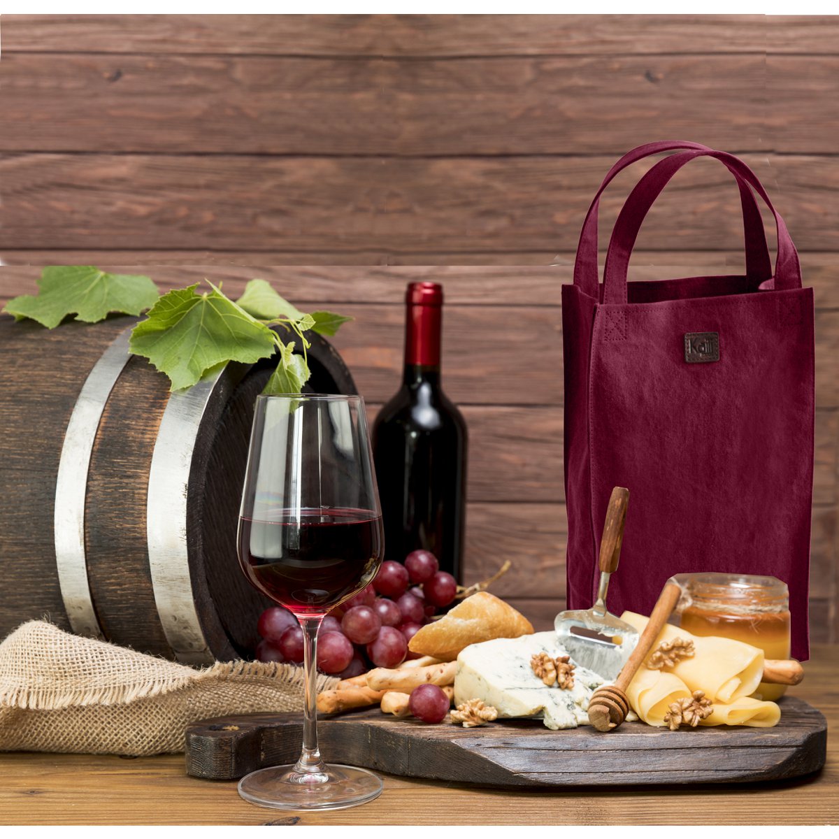 K0017XB | Sac porte-bouteille double en toile/cuir véritable pleine fleur, volant d'inertie. Couleur Bordeaux/Marron Foncé. Capacité : 2 bouteilles. Dimensions : 22 x 37 x 10 cm Conditionnement : Polybag.