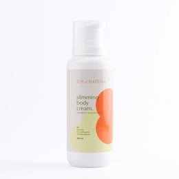 Slimming body cream in a white bottle with orange and green circular designs. The cream is designed to help slim and tone the body.