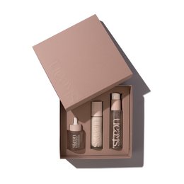  Skincare routine set including cleanser, cream, and face serum in neutral tones.