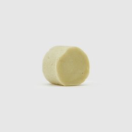 Solid shampoo bar for dry hair, made with natural ingredients like coconut oil and shea butter to gently cleanse and nourish hair.