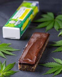 Organic hemp protein bar, raw food, no added sugar, green leaf design, natural healthy snack.