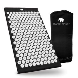 Black yoga mat with 8820 raised nails for acupressure and massage.