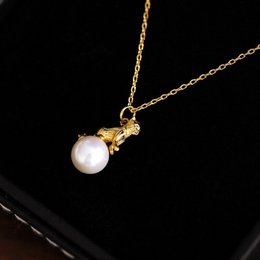 Orecchini e collana asimmetrici con gatti