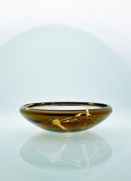 Decorative flat bowl in silver, gold, and purple colors with a splashed design.