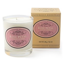  A tall, round, rose-scented candle in a glass container with a rose petal design on the label.