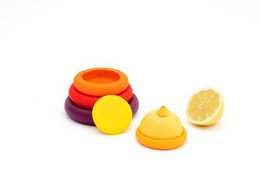 Set of 5 reusable silicone food huggers in autumn harvest colors including orange, red, and yellow. Designed to seal and preserve cut fruits and vegetables.
