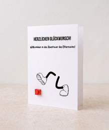  Mother's Day greeting card with red Lego brick characters, cute figures, heartfelt message, multilingual card design.
