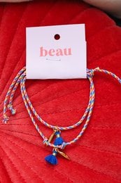 Duo Anklets Mother Daughter, a set of two anklets in a vibrant red color with blue and white beads, designed for a mother and daughter to wear together.