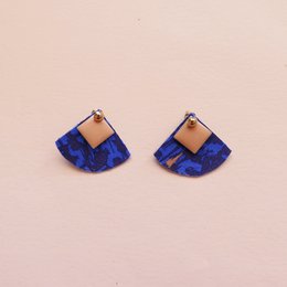 Reversible drop earrings in a powdered blue color with a unique geometric pattern design.
