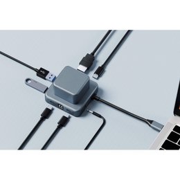 A silver 7-in-1 charging hub with multiple USB ports and cables for charging various devices.