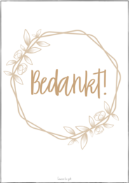 A greeting card with a floral wreath design and the text "Bedankt!" in a warm, earthy color palette. The card appears to be a simple, minimalist design with a focus on the text and natural elements.