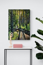 A serene forest path winding through tall, lush trees with sunlight filtering through the canopy.