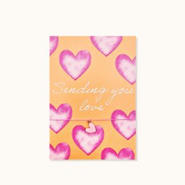 Pink heart pattern card, "Sending you love" text, yellow background, romantic greeting card.