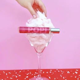 Pink melon vanilla perfume bottle, fruity fragrance, whipped cream aesthetic, vibrant pop design, sweet scent product.