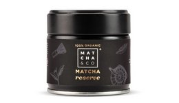 100% organic matcha tea powder in a black tin container with Japanese-inspired design elements.
