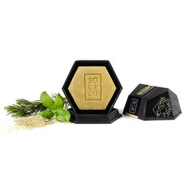 Solid shampoo bar for dry, damaged, or weak hair. Made with natural ingredients like pine needles and herbs. Hexagonal shape with embossed logo.