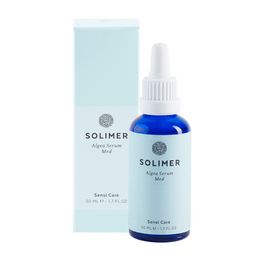A blue-tinted serum in a glass bottle with a white dropper. The bottle is surrounded by a light blue box. This is a facial serum containing algae extract, designed to hydrate and soothe sensitive skin.