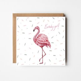A pink flamingo birthday card with the text "Flamingo Birthday Card" and "Looking Fly!" on a white background with scattered confetti-like shapes.