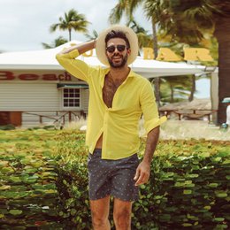  Men's swimming trunks with a camper print pattern in various sizes. Made of lightweight, quick-drying material for comfortable beachwear.