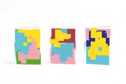 Pack of 3 colorful PIXEL notebooks with abstract geometric patterns in various shapes and colors.