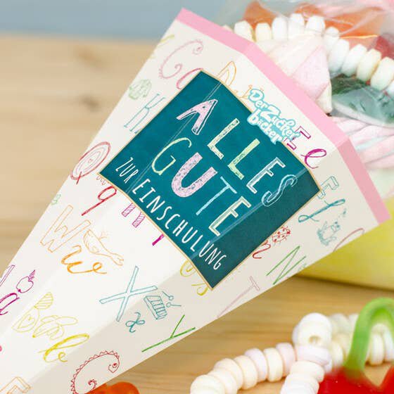 Sac de sucre inscription scolaire rose mélange de bonbons colorés