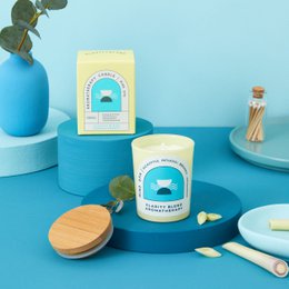 Aromatic candle with a calming, clarity-enhancing scent. Made with natural soy wax and essential oils. Cylindrical shape with a wooden lid. Available in small and medium sizes.