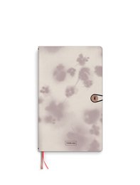 Linen notebook with floral pattern and button closure, suitable for writing, journaling, or note-taking.