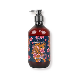 Dark red glass pump bottle with ornate floral botanical pattern design, vegan shower gel.