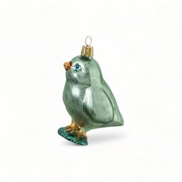 Green glass ornament in the shape of a chick with a red comb and beak.