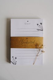 A5 notepad with floral design and text "Du bist toll" (You are great) in various color variants.