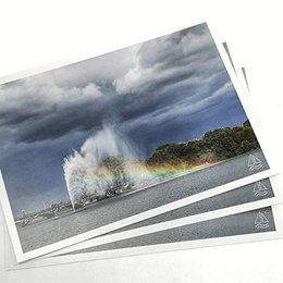 Three images of the ALSTER fountain with a rainbow in Hamburg, Germany. The fountain is surrounded by a stormy sky, creating a dramatic and picturesque scene.