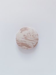 Scent diffuser pebble, a round, stone-like object made of natural materials, designed for home fragrance diffusion.