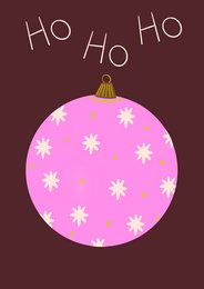Pink ornament with white snowflakes, Christmas cards with holiday designs.
